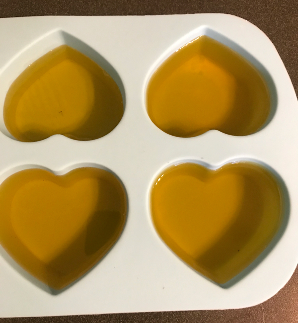 Use a silicone mold to pour your heated oil into to make calendula lotion bars